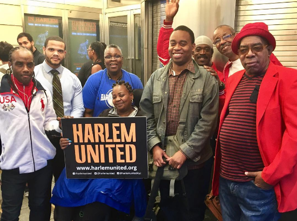 Harlem United clients attend a presidential debate viewing at the Apollo Theater.