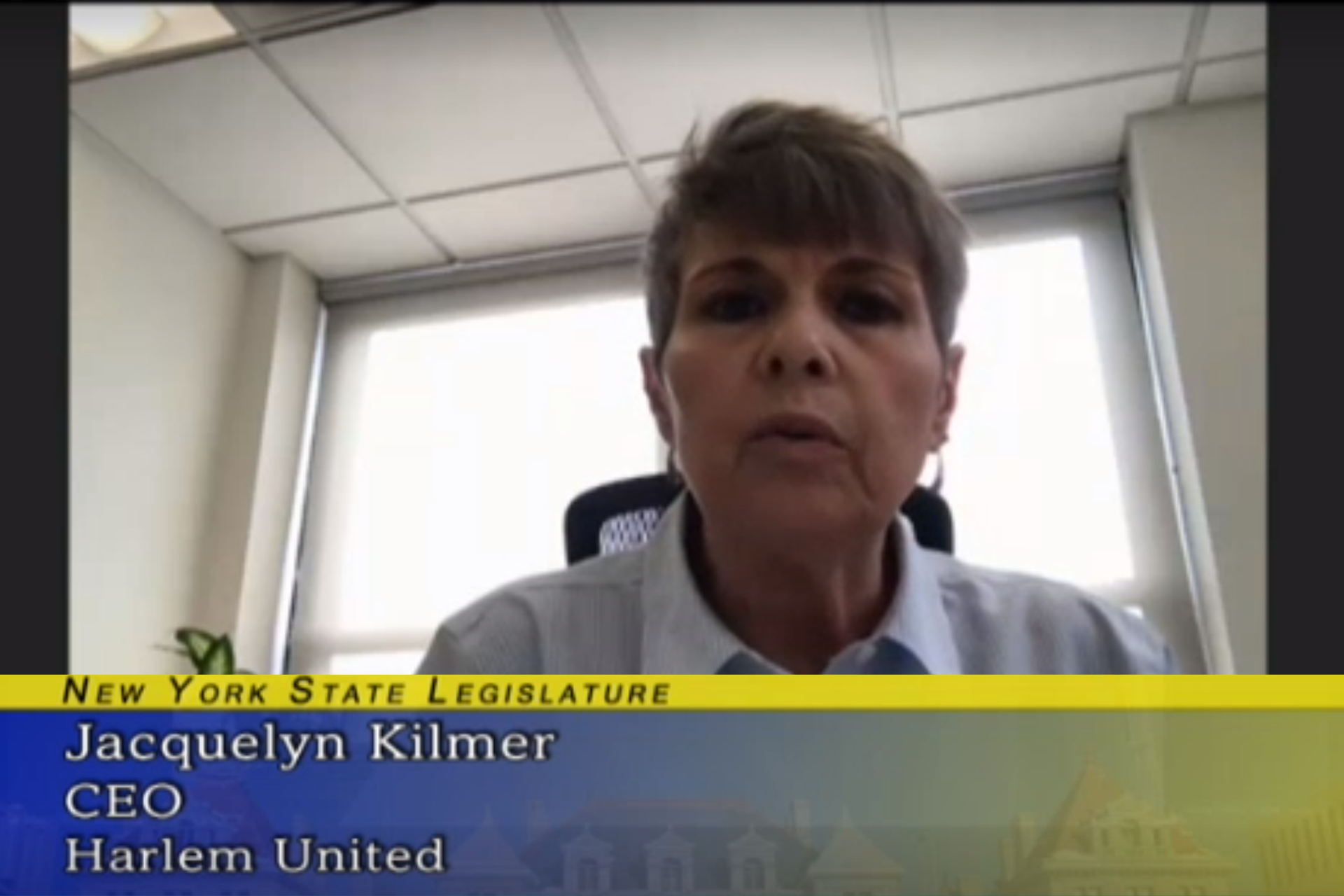 Jacqui Kilmer speaking to the camera. A blue and gold graphic under her face says "New York State Legislature; Jacqui Kilmer; CEO; Harlem United"