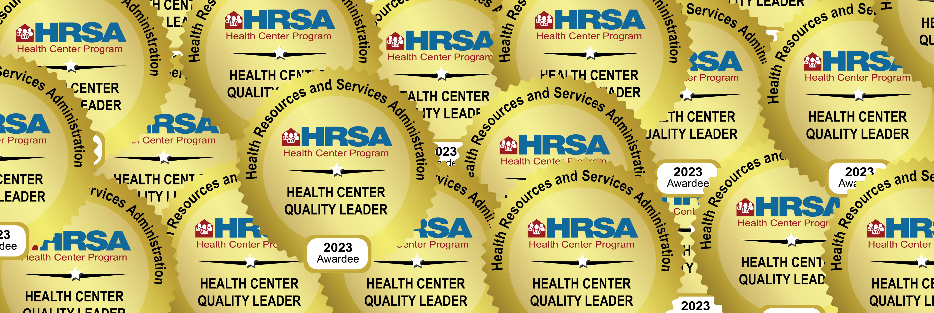 Many overlapping gold seals, all read "HRSA Health Center Quality Leader 2023"